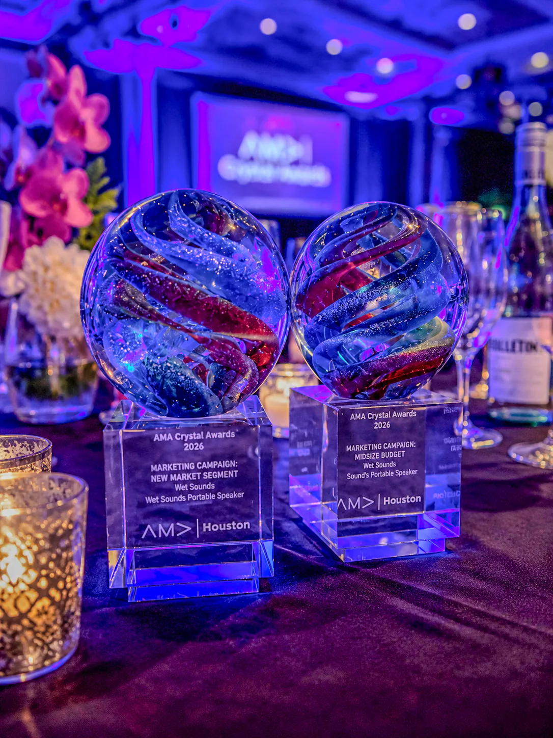 Two 2026 AMA Houston Crystal Awards recognizing the Wet Sounds portable-speaker campaign.